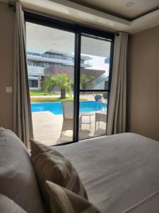 Ένα ή περισσότερα κρεβάτια σε δωμάτιο στο Costa Vista- Standard bedroom flat#501 with private pool- kololi sands +14 φωτογραφίες