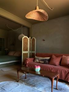 a living room with a couch and a coffee table at The Quarters in Strahan