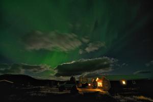 an image of the aurora in the sky at Úthlíd Cottages in Úthlid