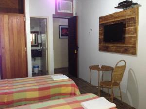 Postel nebo postele na pokoji v ubytování Hotel Pousada Casuarinas