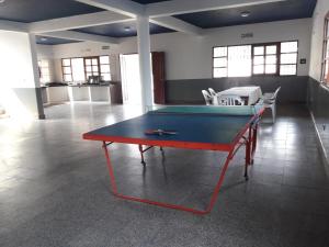 a ping pong table in the middle of a room at EL ESTABLO - Casa de Campo Vacacional con pileta privada - Jujuy in San Salvador de Jujuy