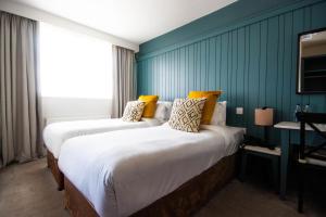 En eller flere senger på et rom på The Martello Hotel