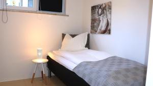 En eller flere senge i et værelse på Luksus lejligheder i Ikast, tæt ved Herning, Silkeborg og Århus