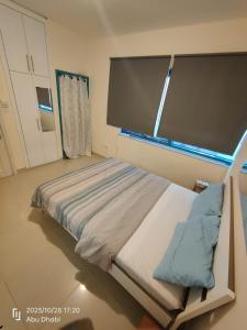 a hospital room with a bed and a projection screen at Master room 1, Couples should be married in Abu Dhabi
