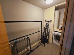 a laundry room with a washing machine and a washer and dryer at Charming 1-Bed Apartment in Newark in Newark-on-Trent