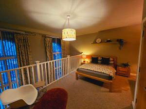 a bedroom with a bed and a chandelier at Charming 1-Bed Apartment in Newark in Newark-on-Trent