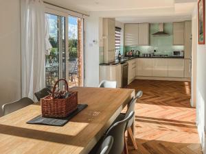 a kitchen and dining room with a table and chairs at Charming 3Bed 3Bath Home in Windsor with parking! in Windsor