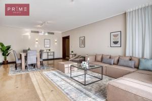 a living room with a couch and a table at Prime Select New Giza in Giza
