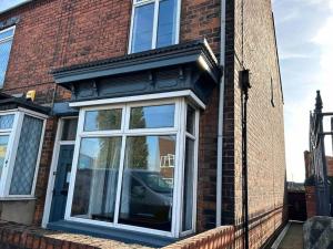 a window on the side of a brick building at 74 Ashby House 3 bed townhouse in Brumby