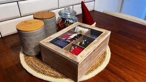 a wooden box sitting on top of a table at APARTMENT KRISTINA in Dunajská Streda