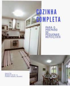a kitchen with white cabinets and a table with chairs at American Hostel in Joinville