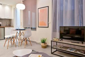 A television and/or entertainment centre at Walk to Syntagma,from a prime-location, luxury apt