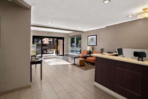 a lobby with a reception desk and a living room at Comfort Inn Lacey - Olympia in Lacey