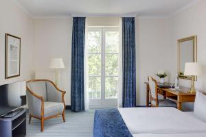 Voodi või voodid majutusasutuse Dorint Parkhotel Meißen toas