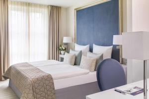 Voodi või voodid majutusasutuse Dorint Parkhotel Meißen toas