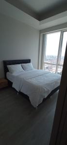 Een bed of bedden in een kamer bij Luxury 1+1 bed in NG resident