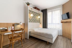 Postel nebo postele na pokoji v ubytování CALM Appart' & Hostel