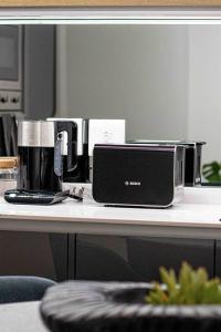 a coffee maker sitting on a table next to a coffee pot at Epic Getaway in Waterfall in Midrand