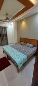 a bedroom with a bed in a room at Anant home stay in Ujjain