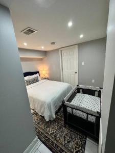 a bedroom with a bed and a room with a door at Downtown Delight in Heart of DC’s Bustling Streets in Washington