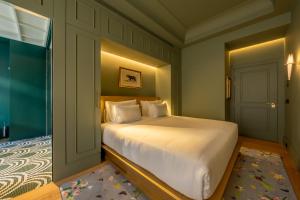 Postel nebo postele na pokoji v ubytování Art Legacy Hotel Baixa-Chiado