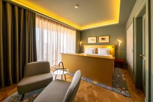 Postel nebo postele na pokoji v ubytování Art Legacy Hotel Baixa-Chiado