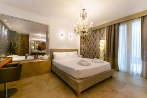 a bedroom with a large bed and a bathroom at Admiral Park Hotel Bologna by Falco D'Oro Hotels in Zola Predosa +85 photos
