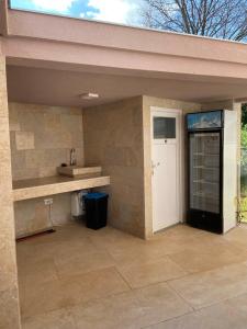 a patio with a counter and a sink and a door at Villa Maduna 1 in Kaštel