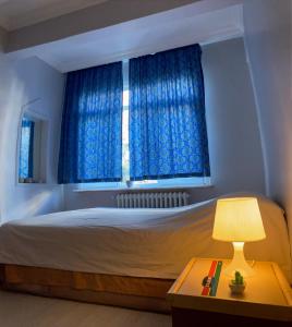 Postel nebo postele na pokoji v ubytování Lebowski's Boho Residence