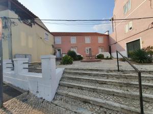 a set of stairs in front of some buildings at Zabava Sacavém in Sacavém