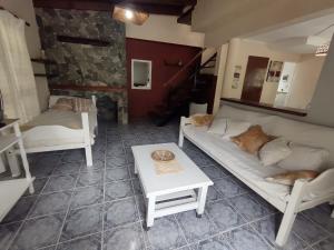 a living room with a couch and a table at DEPARTAMENTO UMARDA in Tandil