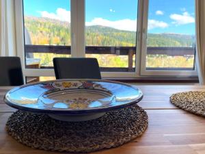 a table with a plate on top of a table at Mountain Escape Loft in Buşteni
