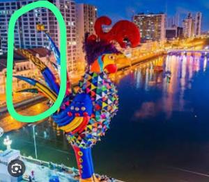 a picture of a colorful sculpture in the water at Melhor localização Recife até 8 pessoas in Recife