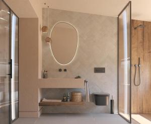 a bathroom with a sink and a mirror at Villa Merilen in Develíkia