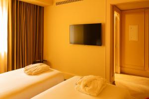Postel nebo postele na pokoji v ubytování Art Legacy Hotel Baixa-Chiado