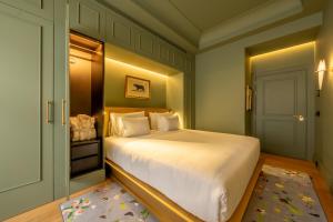 Postel nebo postele na pokoji v ubytování Art Legacy Hotel Baixa-Chiado