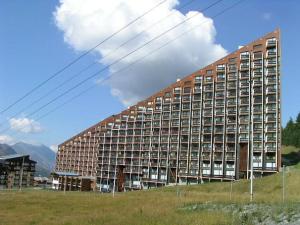 a large building in the middle of a field at Studio lumineux avec balcon, au pied des pistes, Les Menuires – 3 personnes - FR-1-452-17 in Les Menuires +10 photos