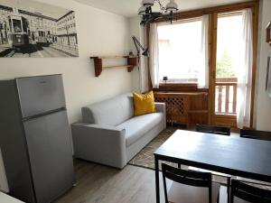 Posezení v ubytování da Robi appartamento fronte piste