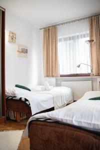 Postel nebo postele na pokoji v ubytování Hostel Wielka Krokiew