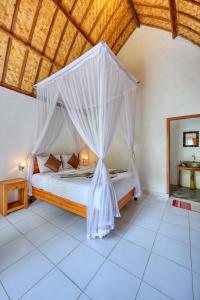 Ένα ή περισσότερα κρεβάτια σε δωμάτιο στο Ananta Bungalow