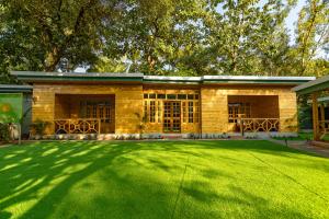 a house with a large lawn in front of it at Oxygen Palolem in Palolem +37 photos
