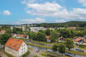 an aerial view of a town with a road and buildings at Sea Apartment with Parking by Renters in Gdańsk