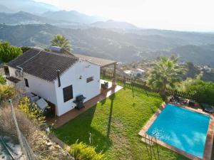 an aerial view of a house with a swimming pool at Vela Luka Frigiliana in Frigiliana