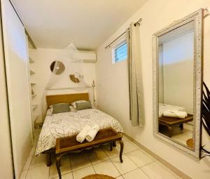 Una cama o camas en una habitación de Sous les Tropiques…Vue mer