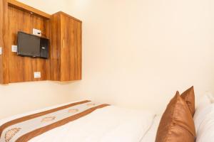 Postel nebo postele na pokoji v ubytování Hotel BKC Fortune