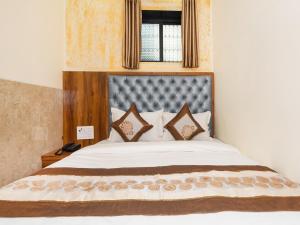 Postel nebo postele na pokoji v ubytování Hotel BKC Fortune