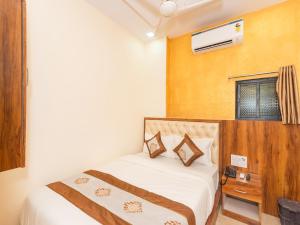 Postel nebo postele na pokoji v ubytování Hotel BKC Fortune