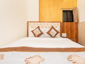 Postel nebo postele na pokoji v ubytování Hotel BKC Fortune
