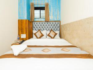 Postel nebo postele na pokoji v ubytování Hotel BKC Fortune