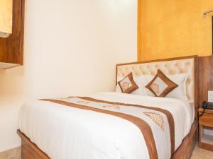Postel nebo postele na pokoji v ubytování Hotel BKC Fortune